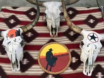 Cowboy Plaque and Skulls